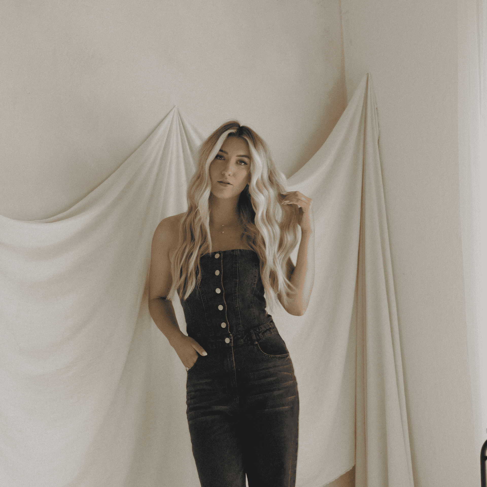 Portrait of Taylor Kostal, a professional stylist at Salon BIJOU, showcasing their expertise and style.